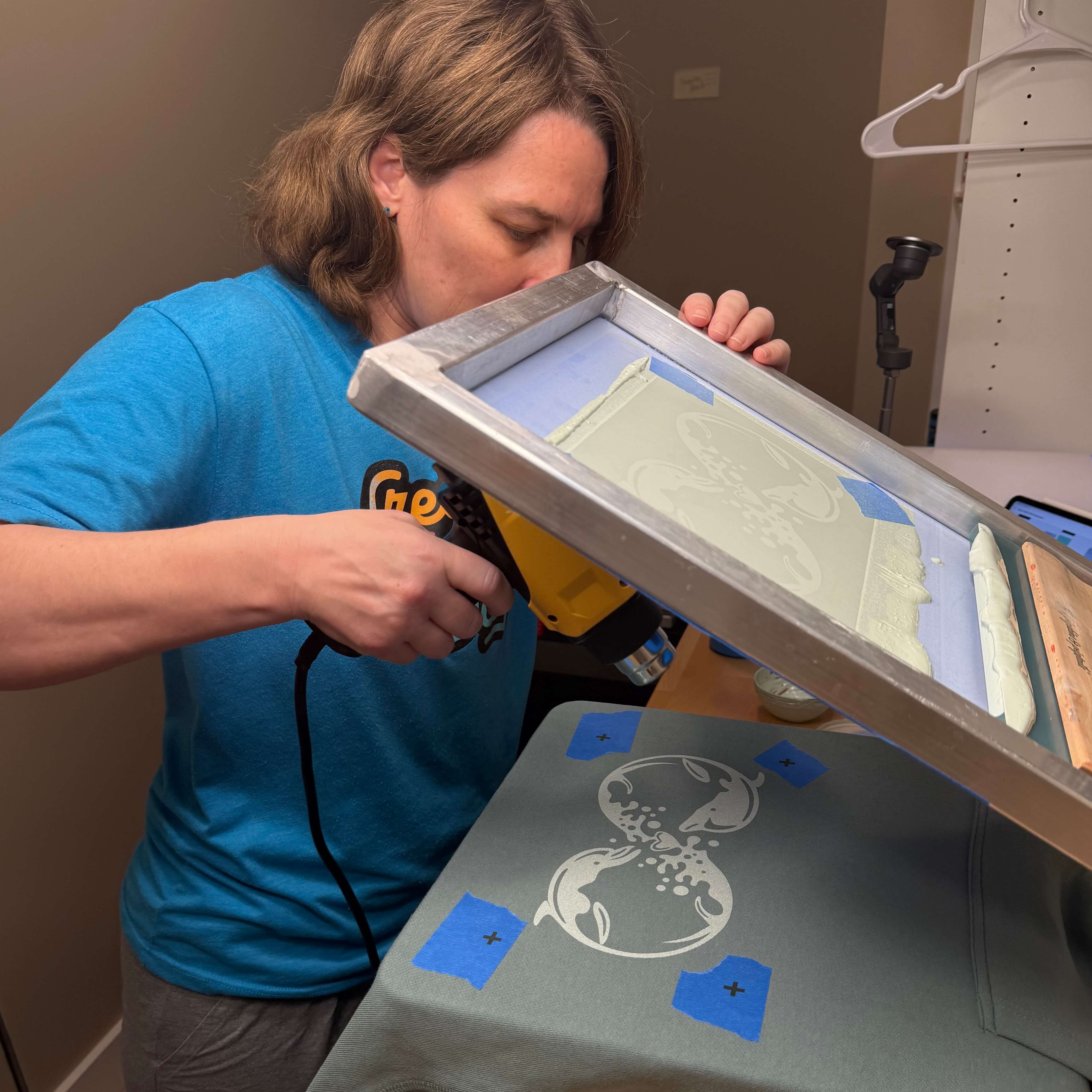 Close-up of ink being pulled across the screen