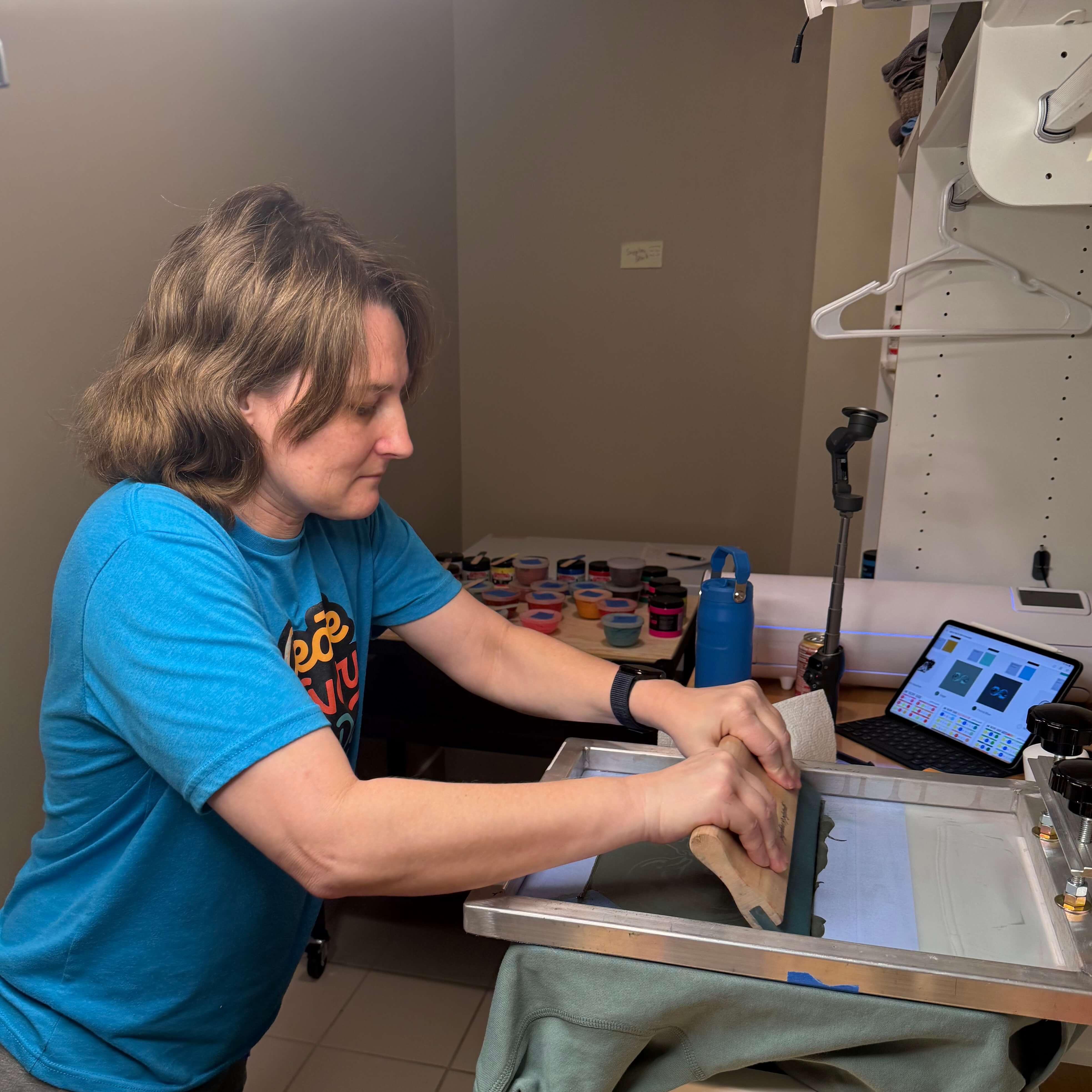 Fresh Los Místicos print drying on the rack